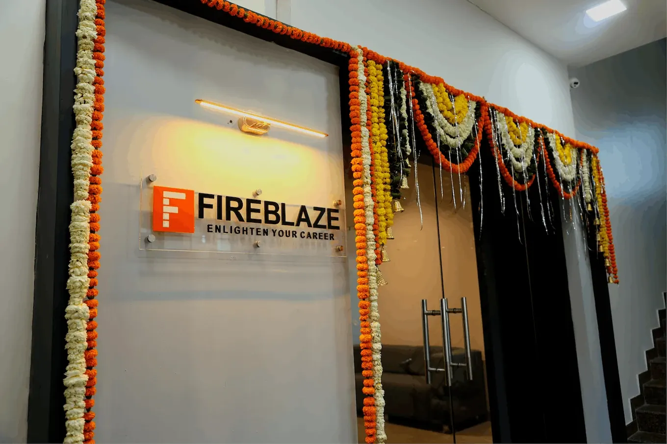 Garlanded entrance of Fireblaze AI School's Mate Square office on its inauguration day