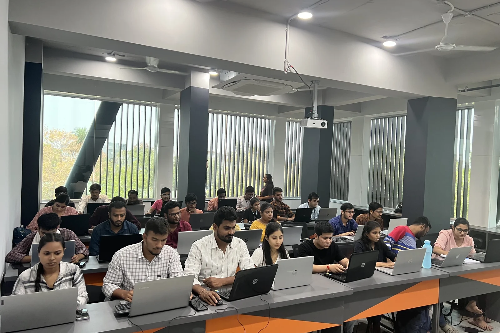 A full lab of learners working on laptops at a Fireblaze AI School centre in Nagpur
